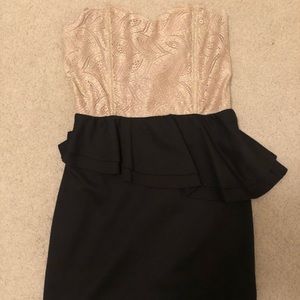 Strapless cocktail dress with peplum around waist